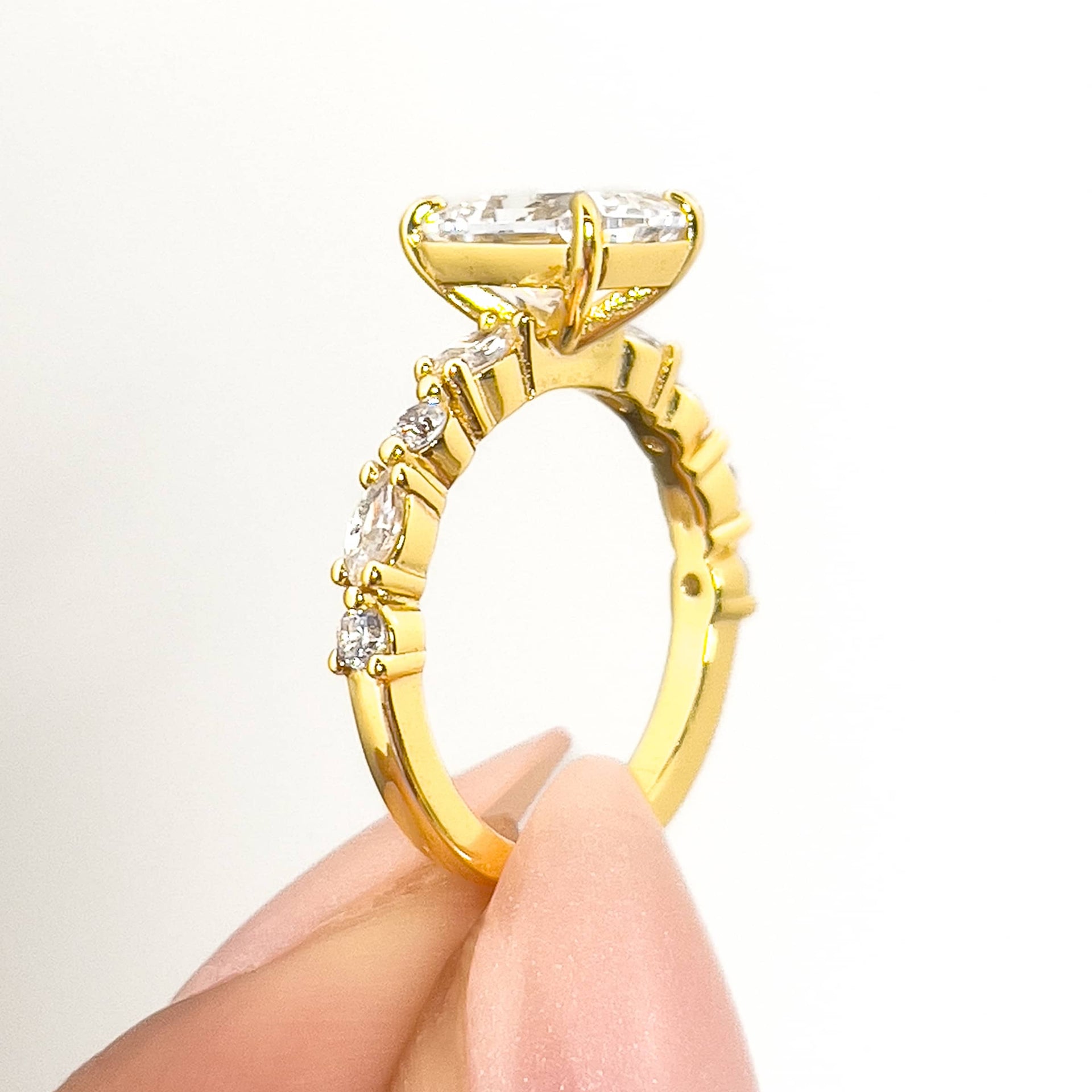 setting shot of a gold vintage 2 carat radiant cut engagement ring