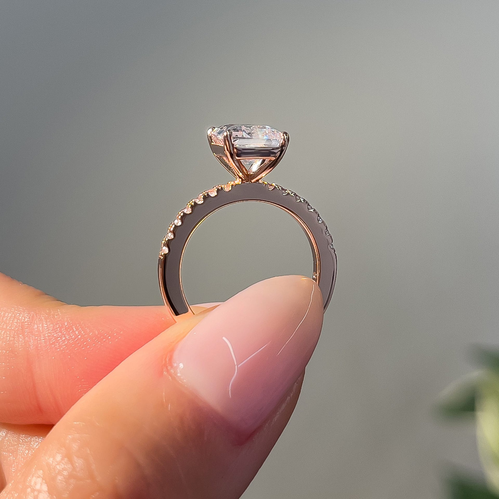 stunning emerald cut rose gold setting shot of the sage