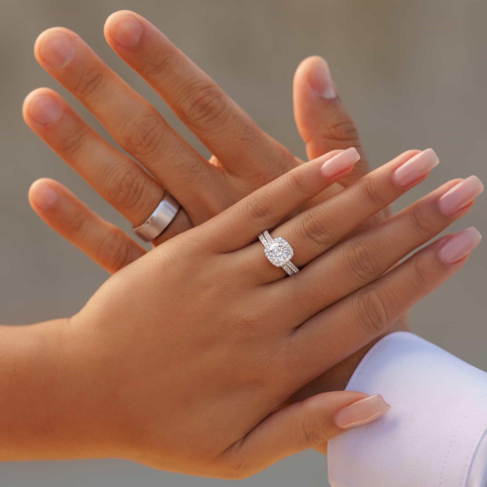 stunning his and hers silver wedding rings shown on model's hands