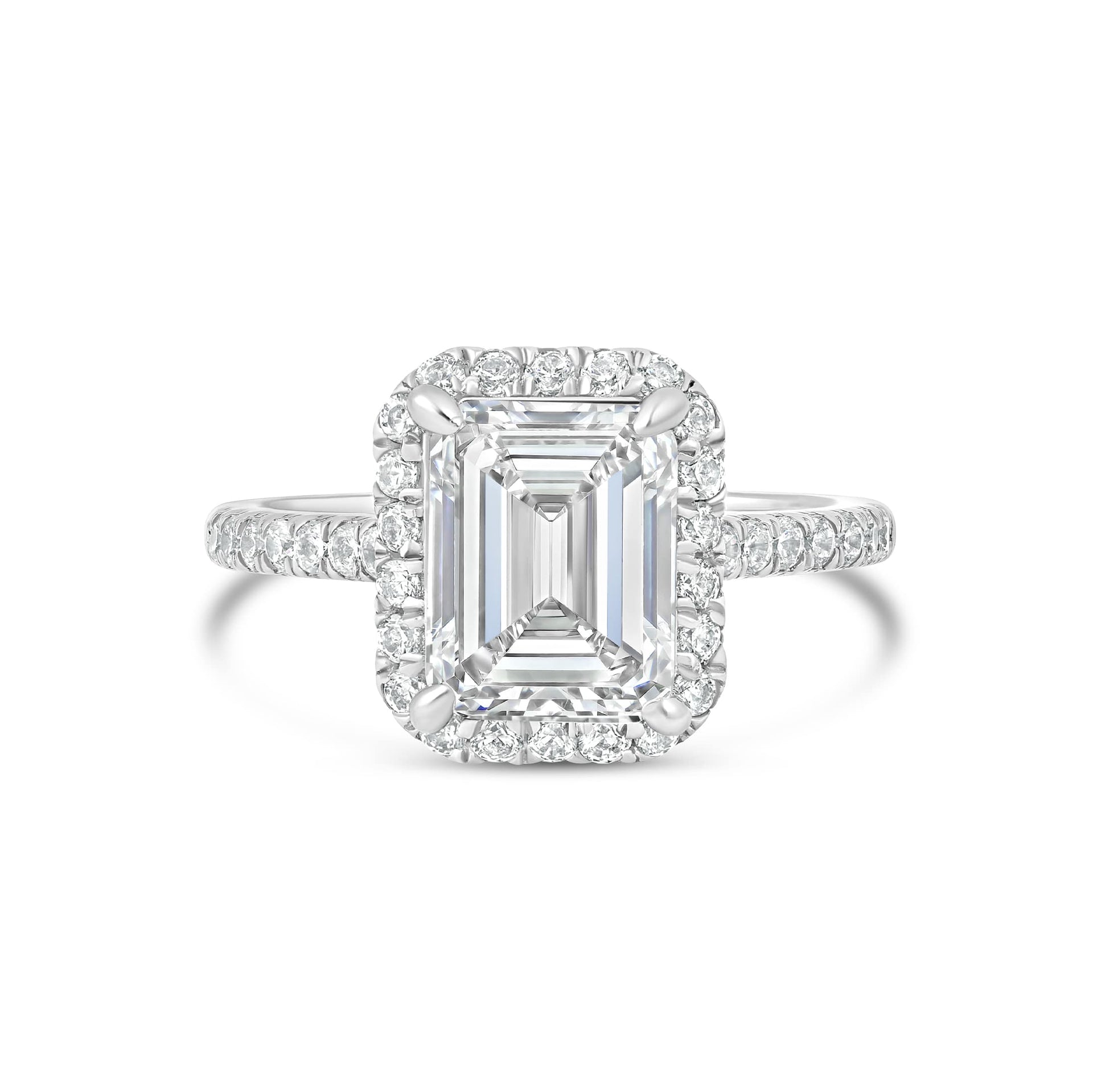 stunning emerald cut engagement ring on white background