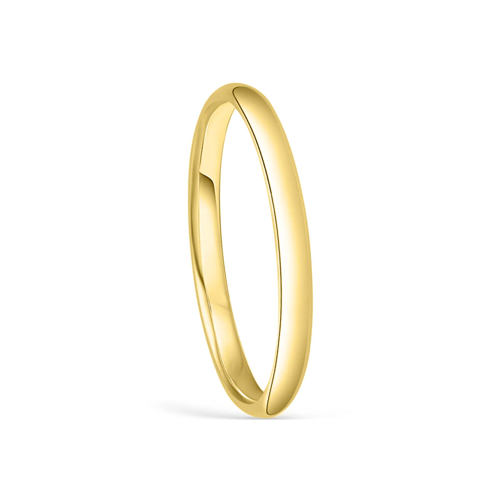 stunning setting shot of gold wedding band on white background