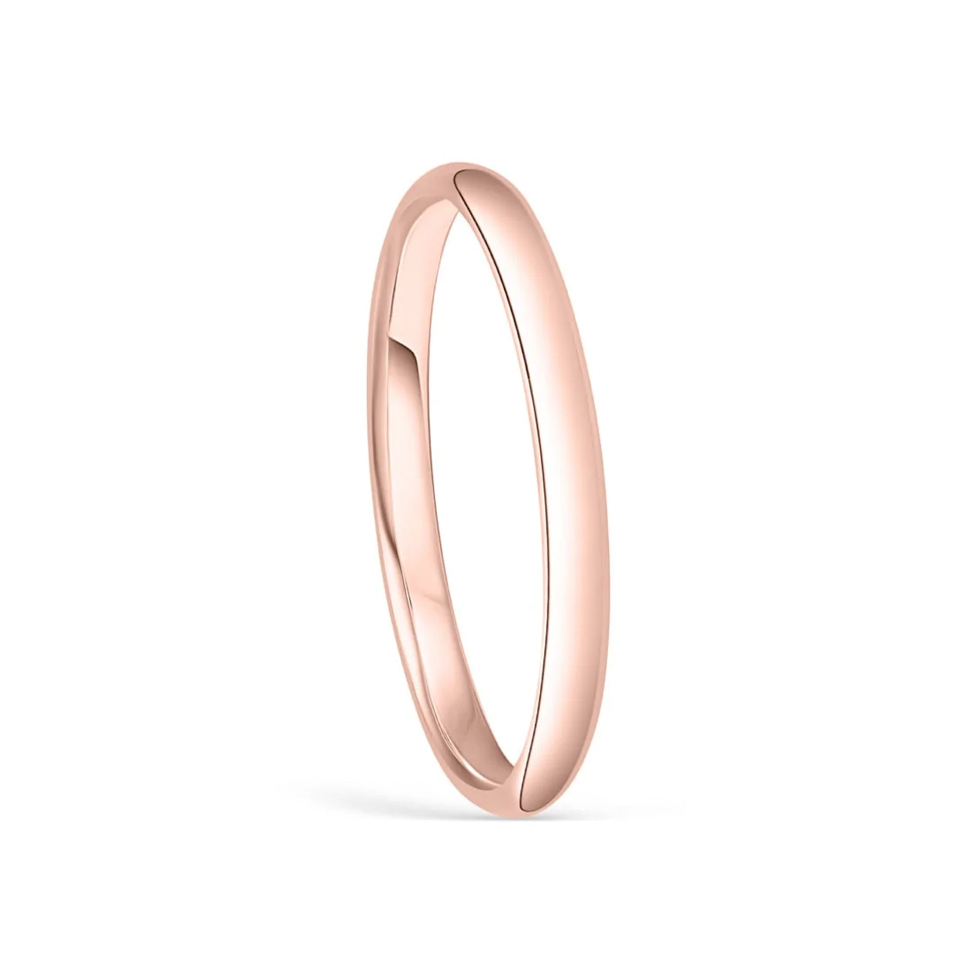 stunning setting shot of rose gold wedding band on white background