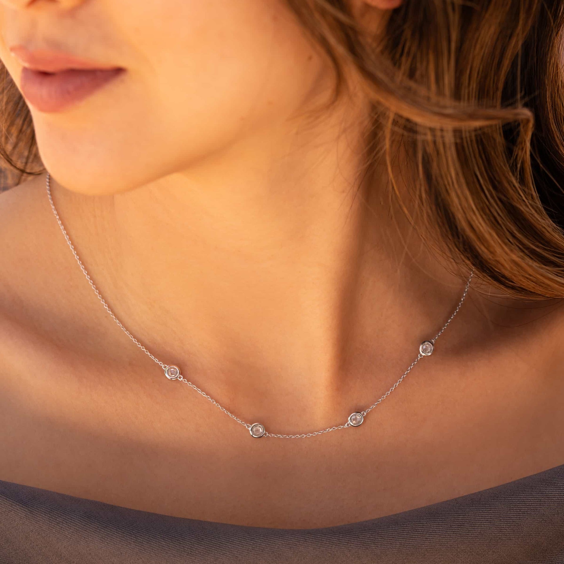 stunning silver necklace on model's neck 