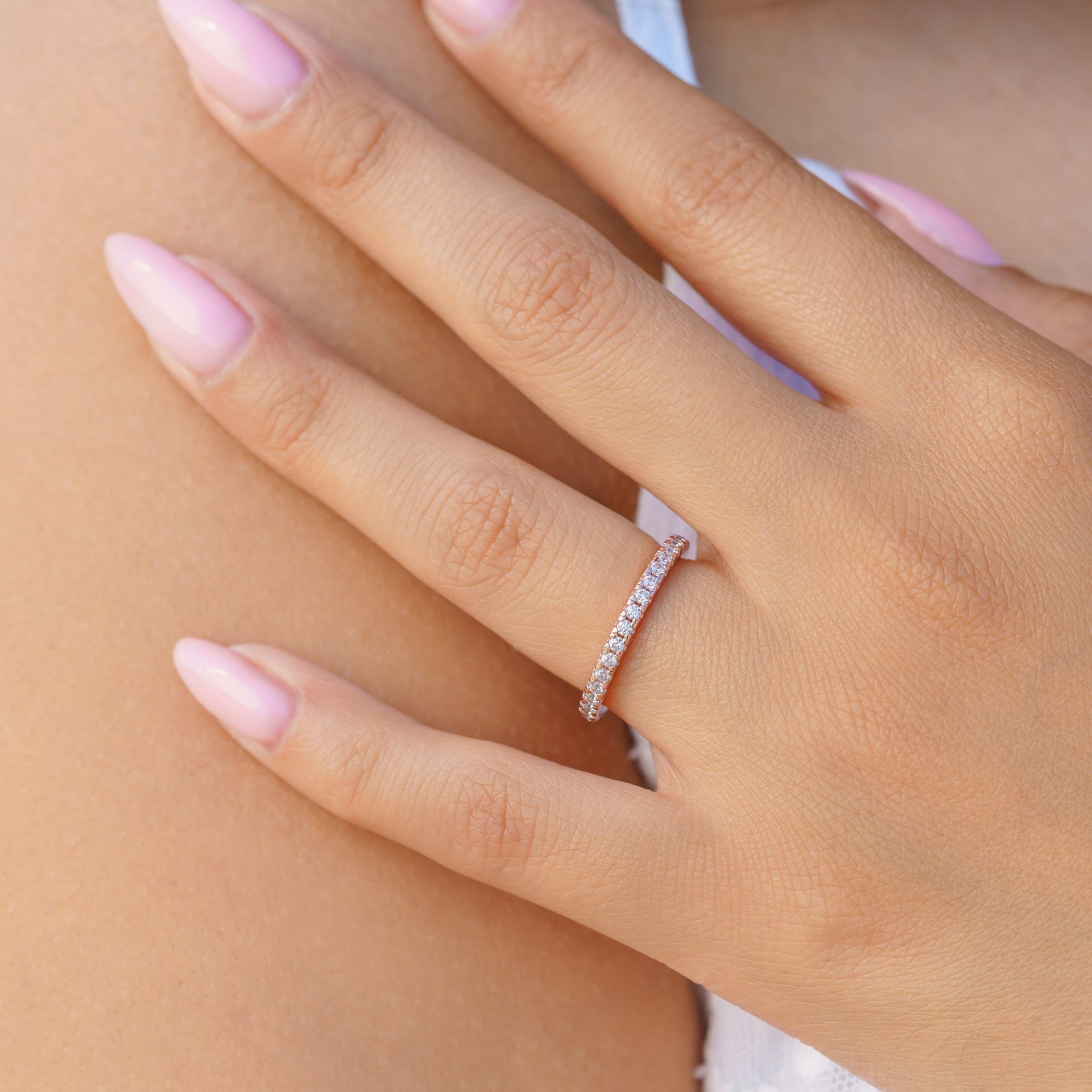 woman wearing rose gold wedding band