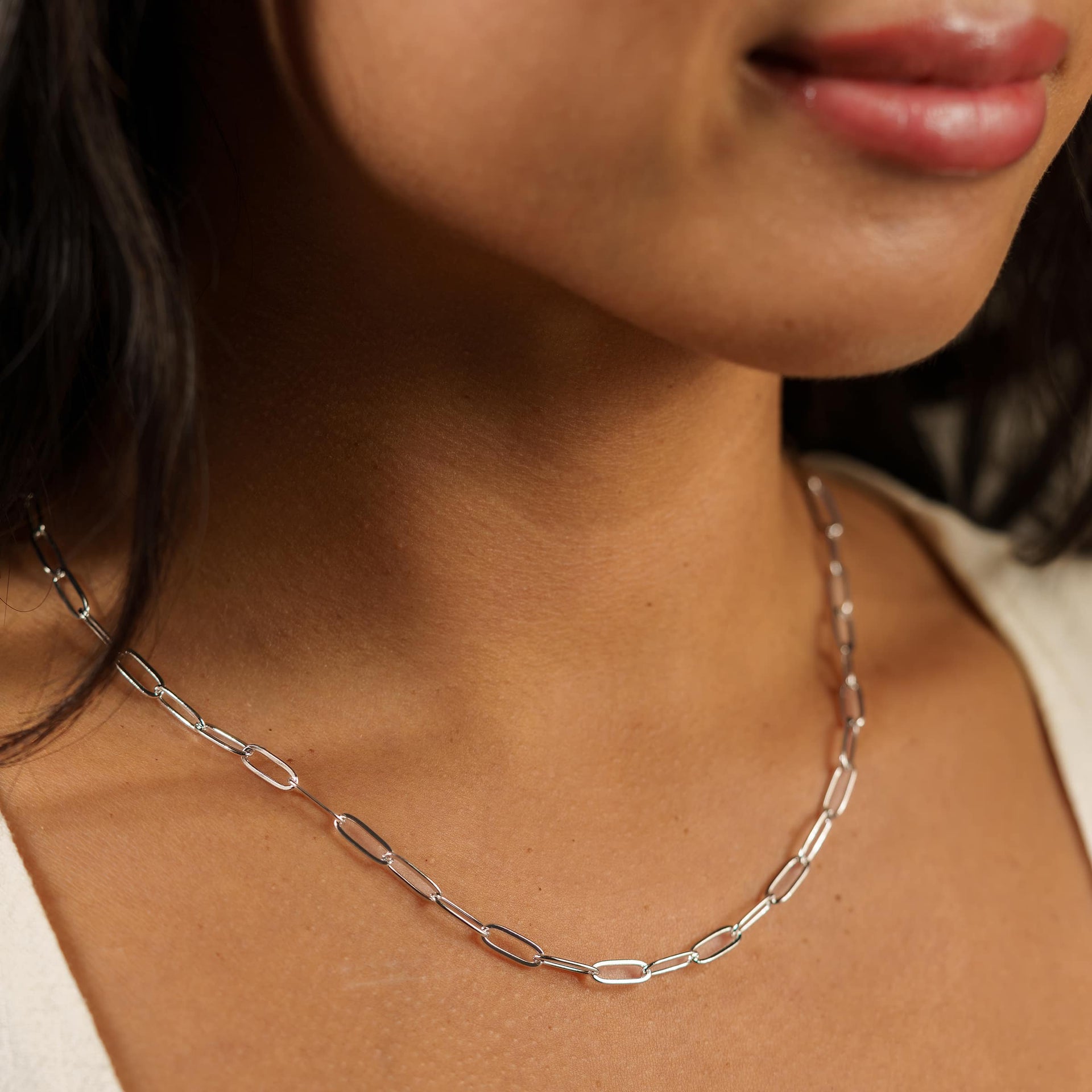 silver paperclip style chain necklace on model