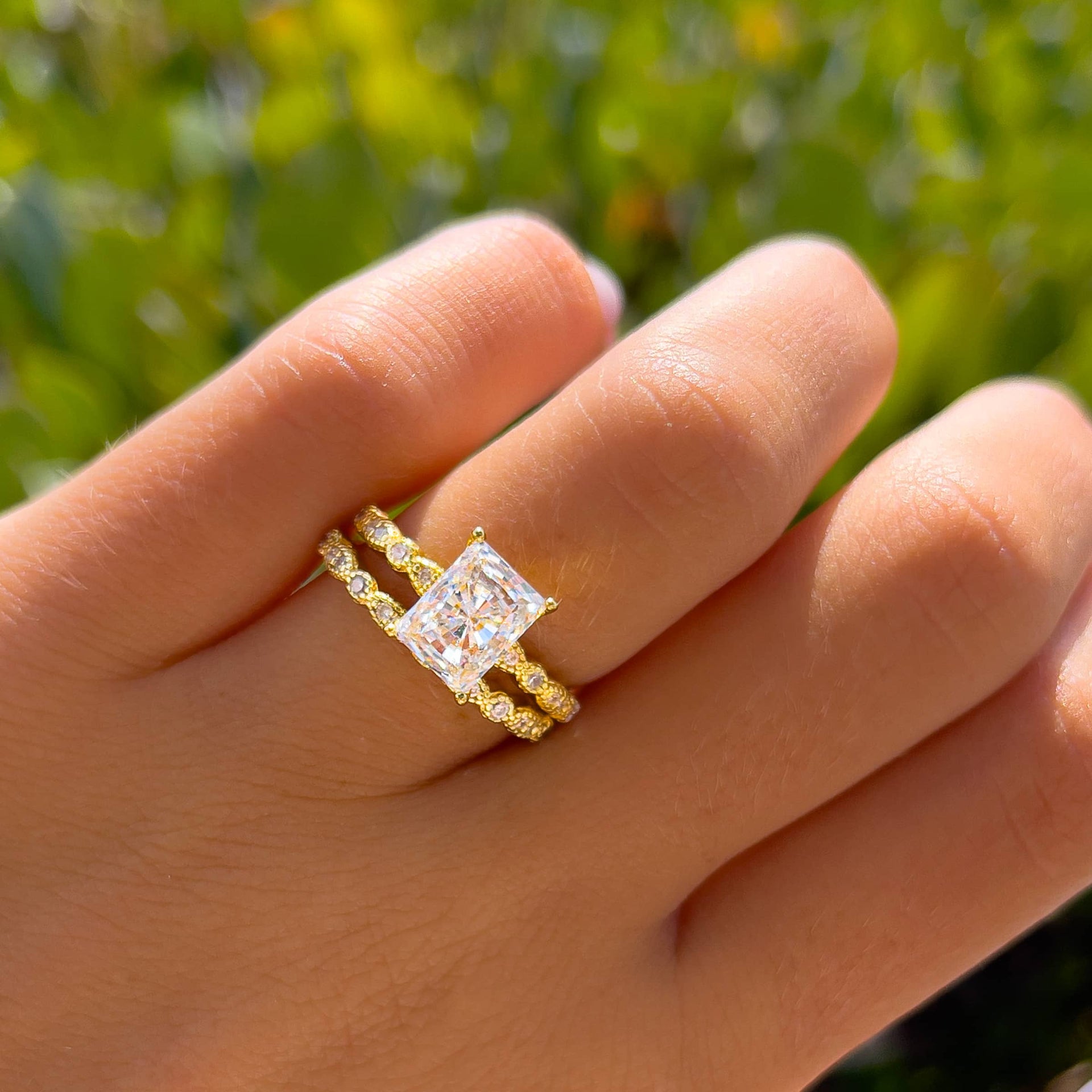 gold vintage radiant cut wedding set on model