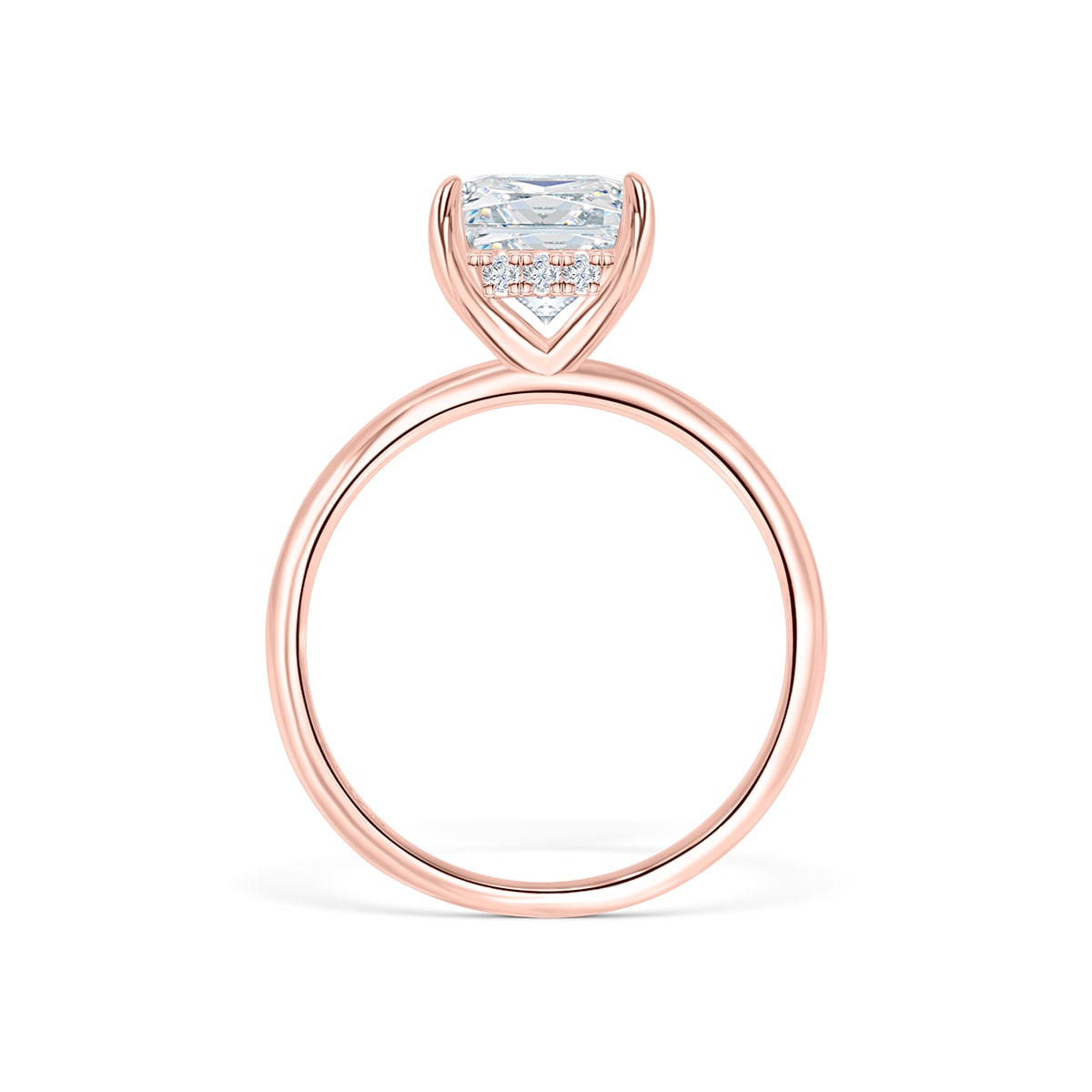 Side profile of hidden halo rose gold radiant cut ring