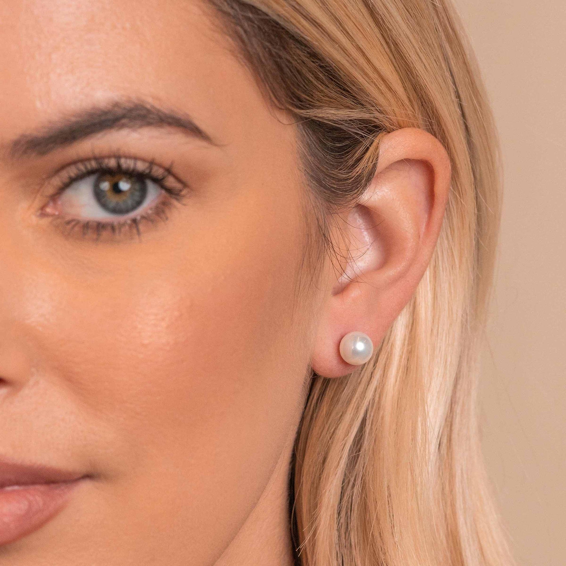 Woman wearing pearl earrings