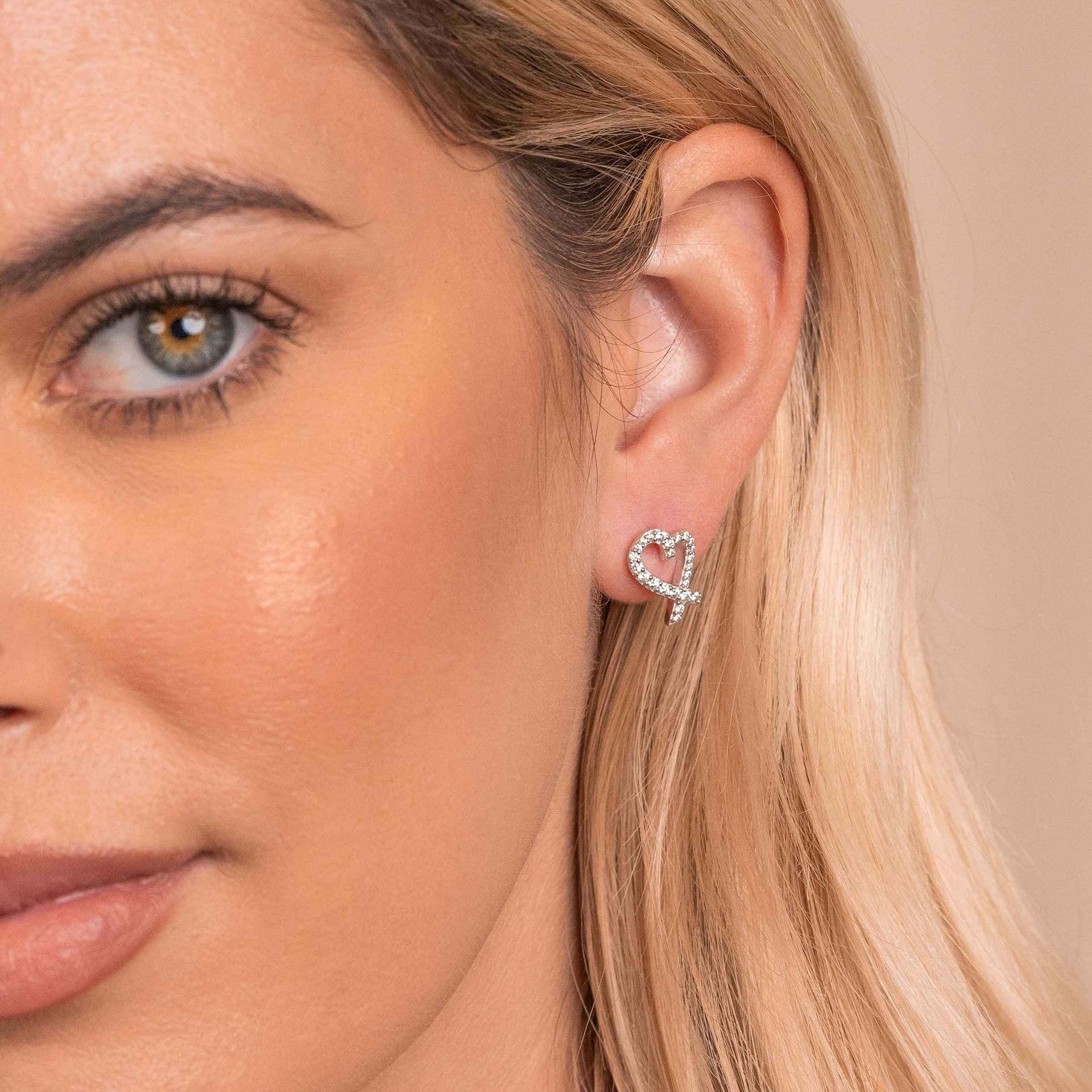 Cute heart shaped earrings on model
