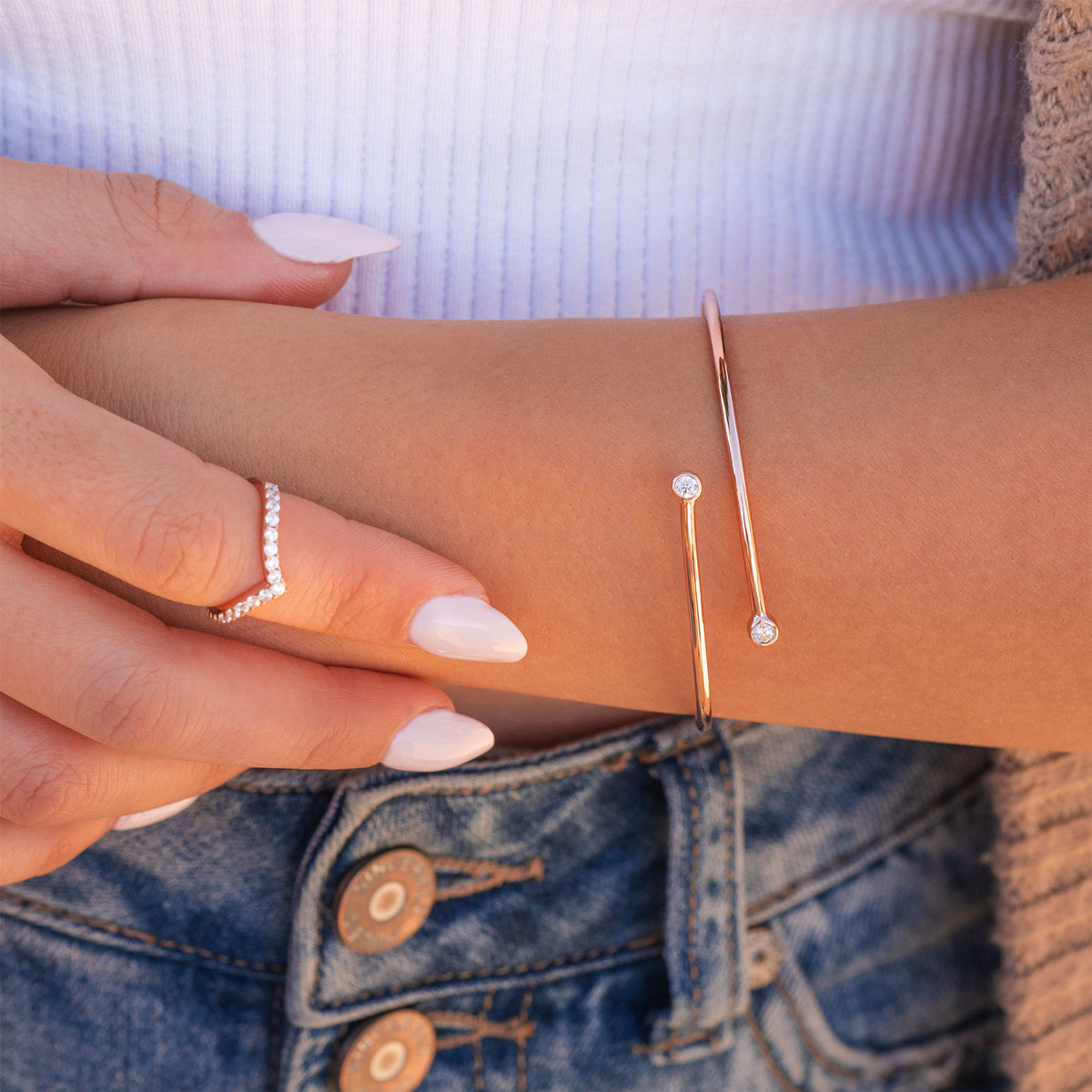 Rose gold bangle bracelet on model