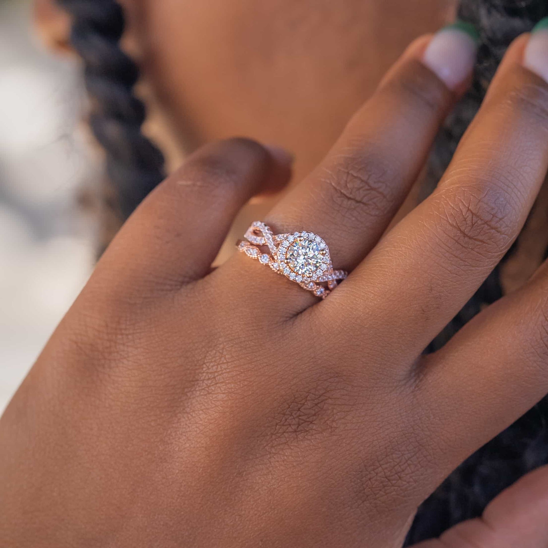 Woman wearing a rose gold round cut wedding ring