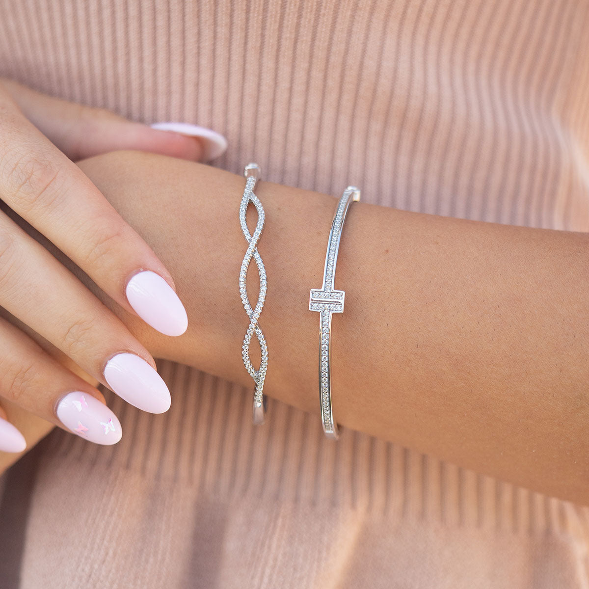 Silver twisted bangle bracelet on wrist