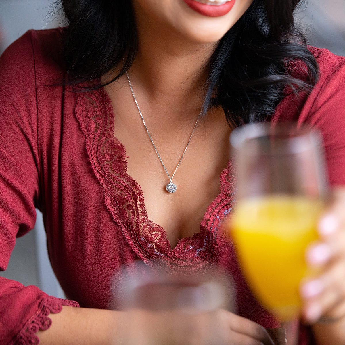 lady wearing the lily silver necklace