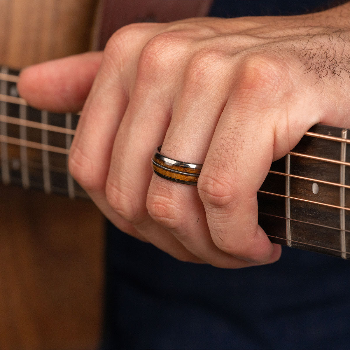 Mens wedding band with guitar string inlay