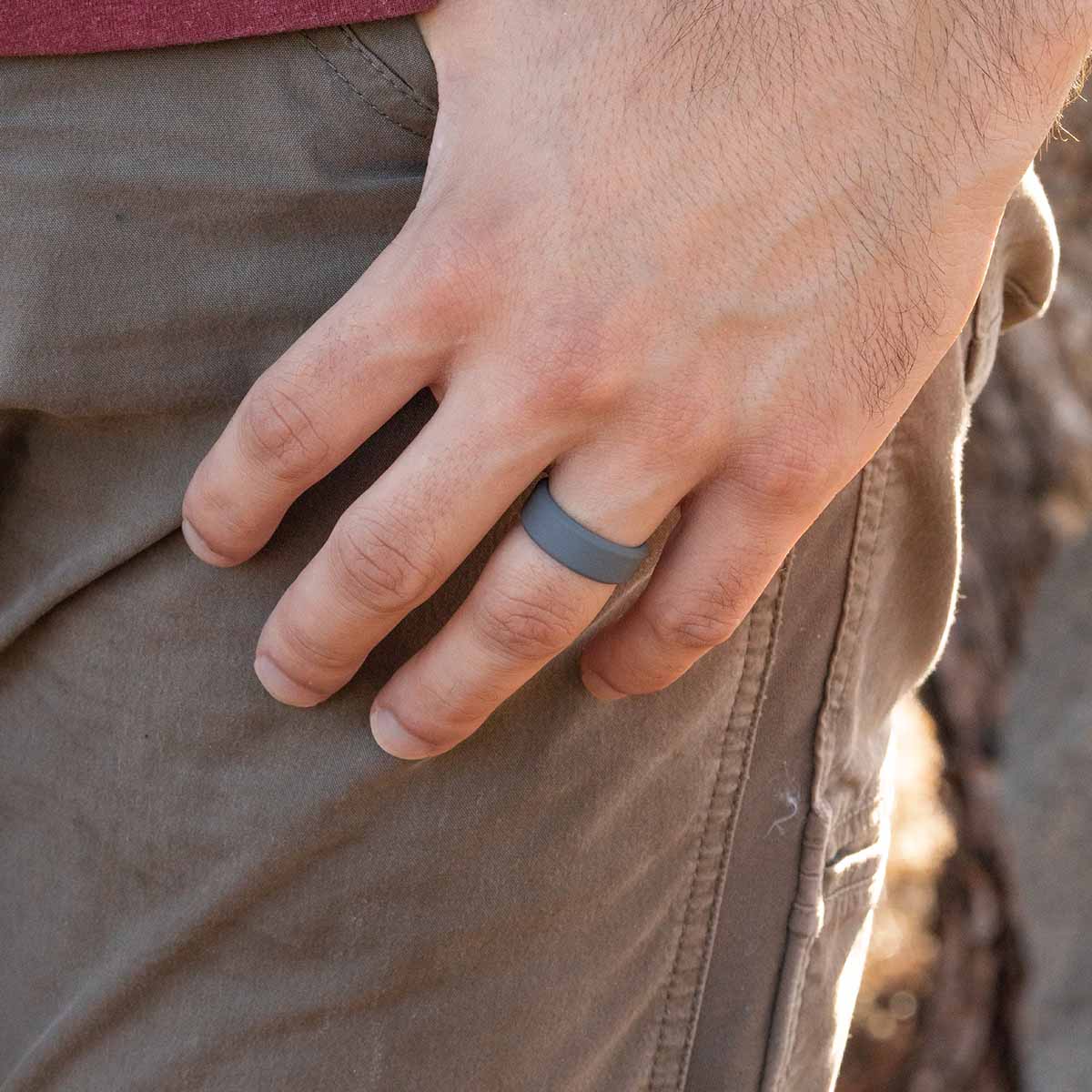 Gray silicone wedding ring on a male hand