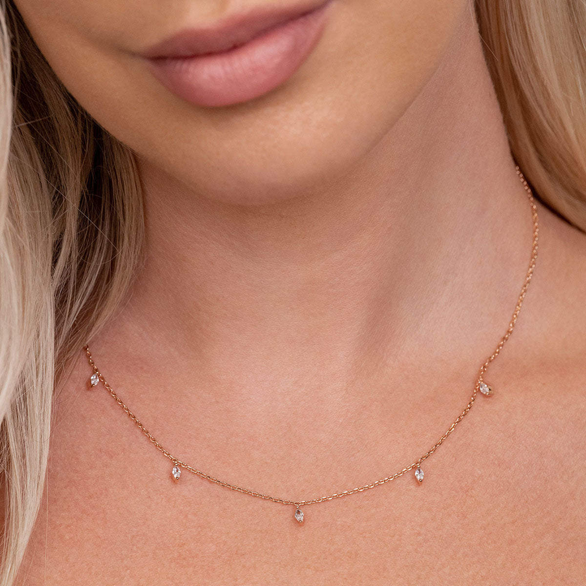 Rose gold stud necklace on model