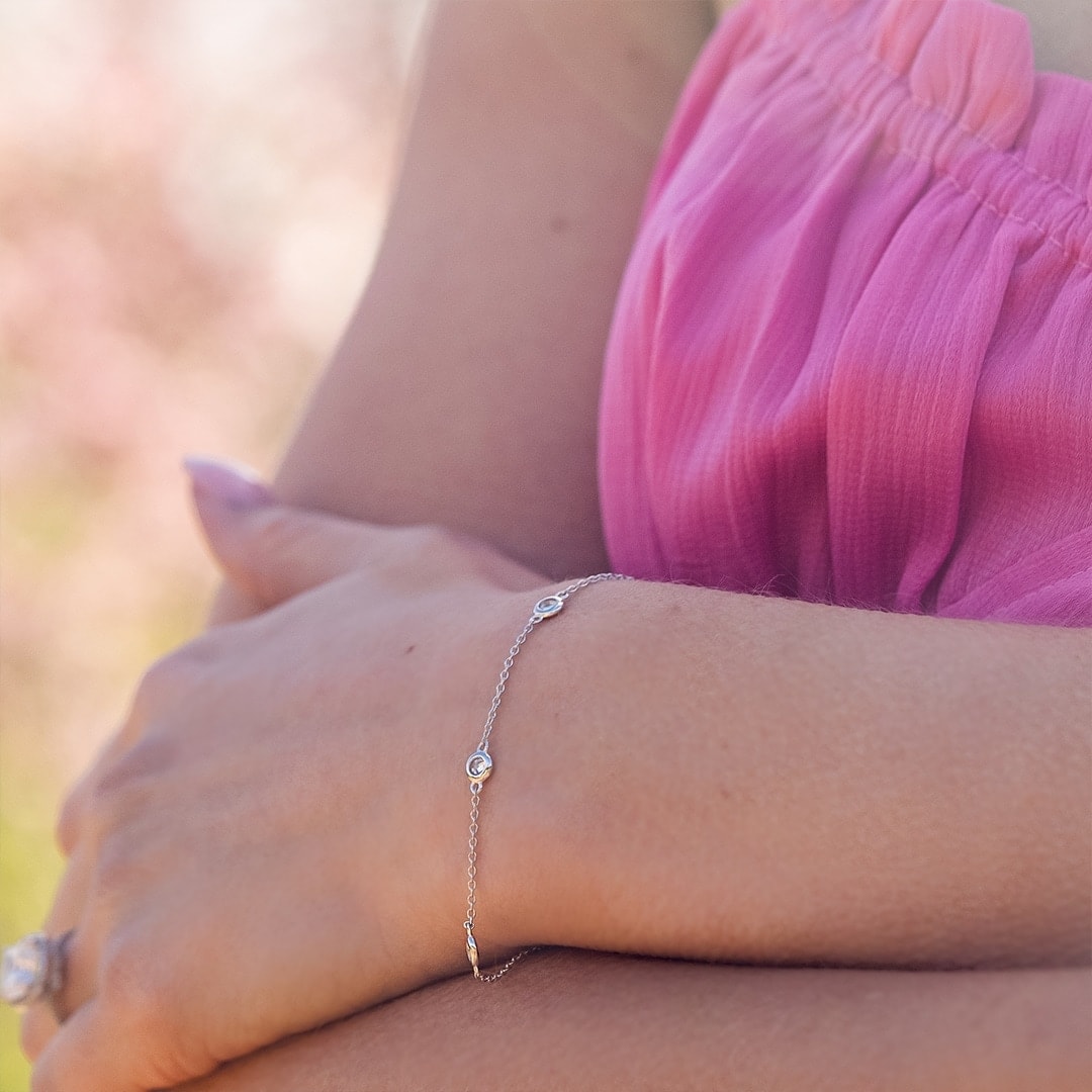 female wearing silver bracelet