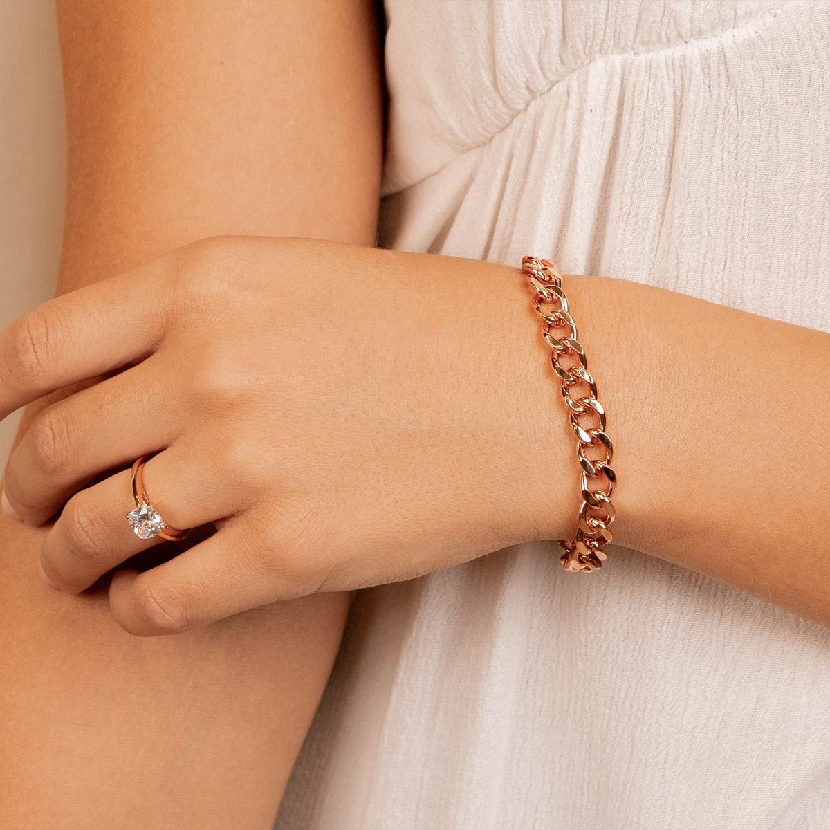 Thick rose gold chain bracelet on model