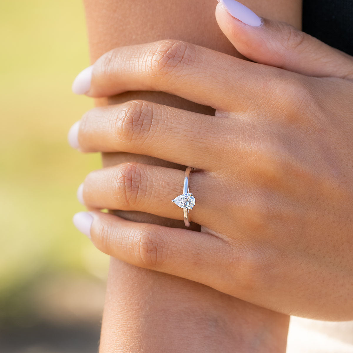 silver daisy pear cut engagement ring
