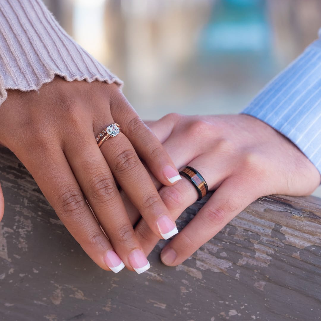 couple wearing wedding rings