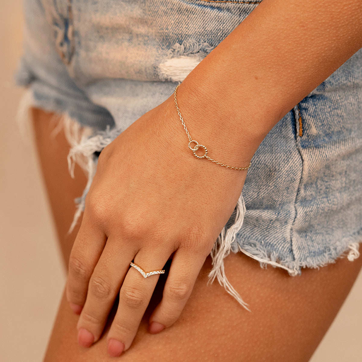 Woman wearing gold chain bracelet