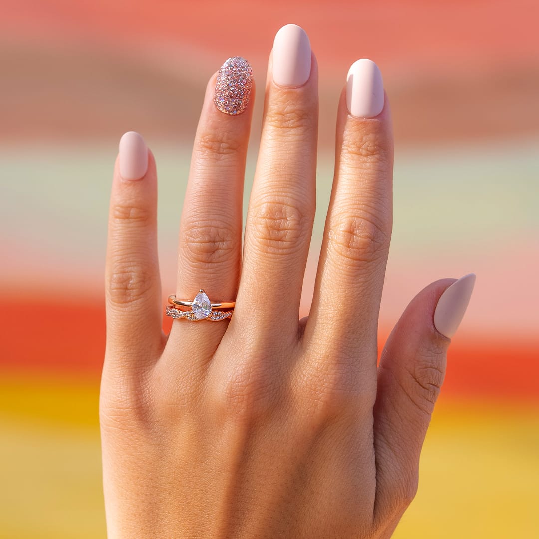 the daisy pear cut rose gold wedding ring