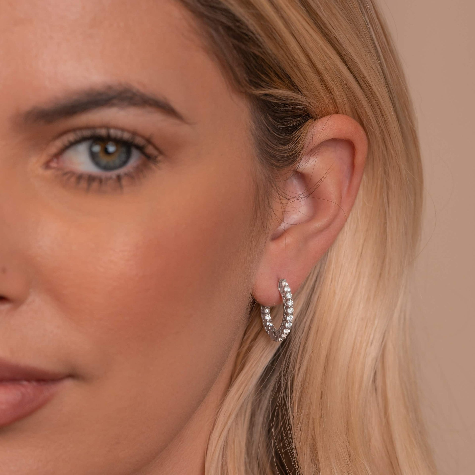 Cute silver hoop earrings on model