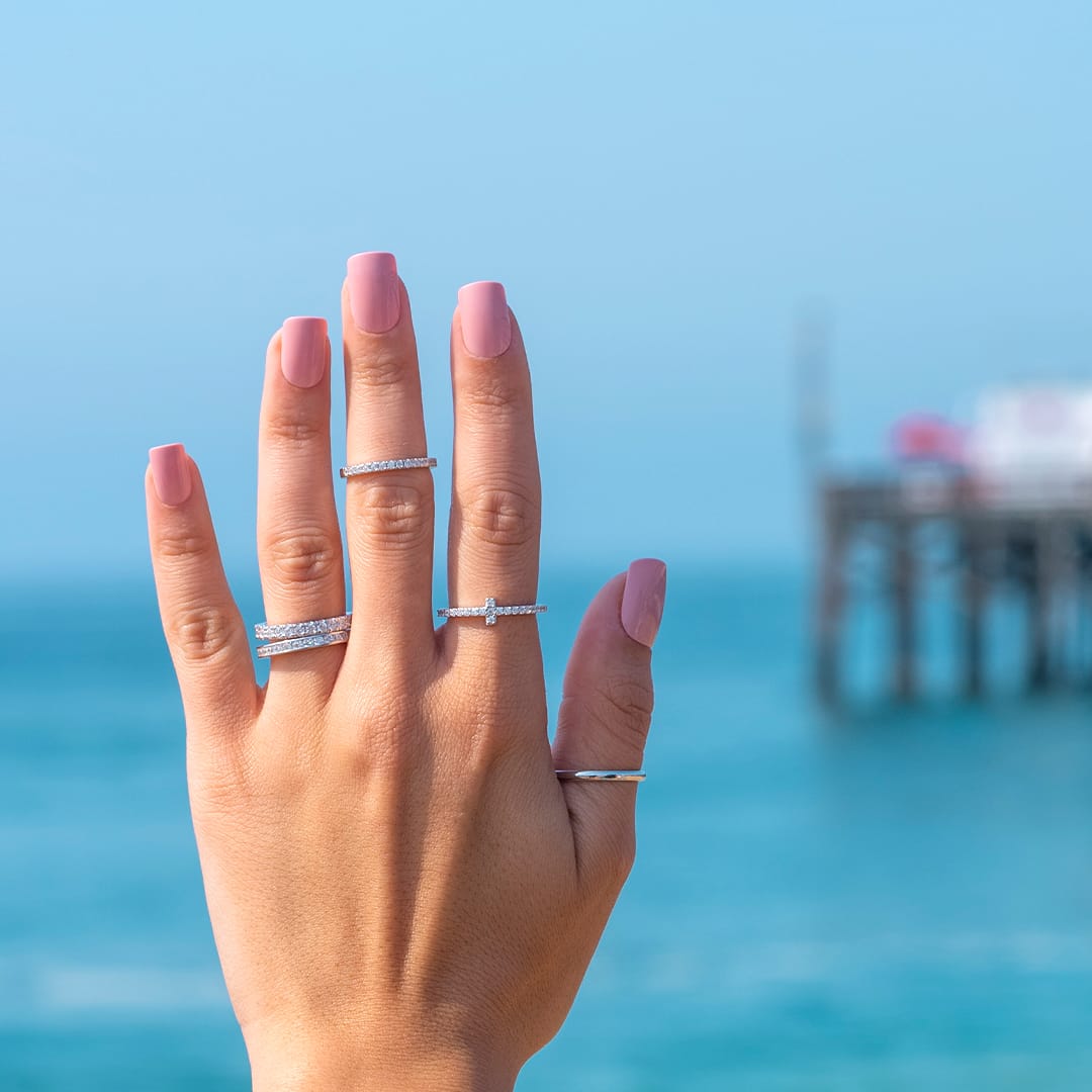 hand in the air wearing wedding rings